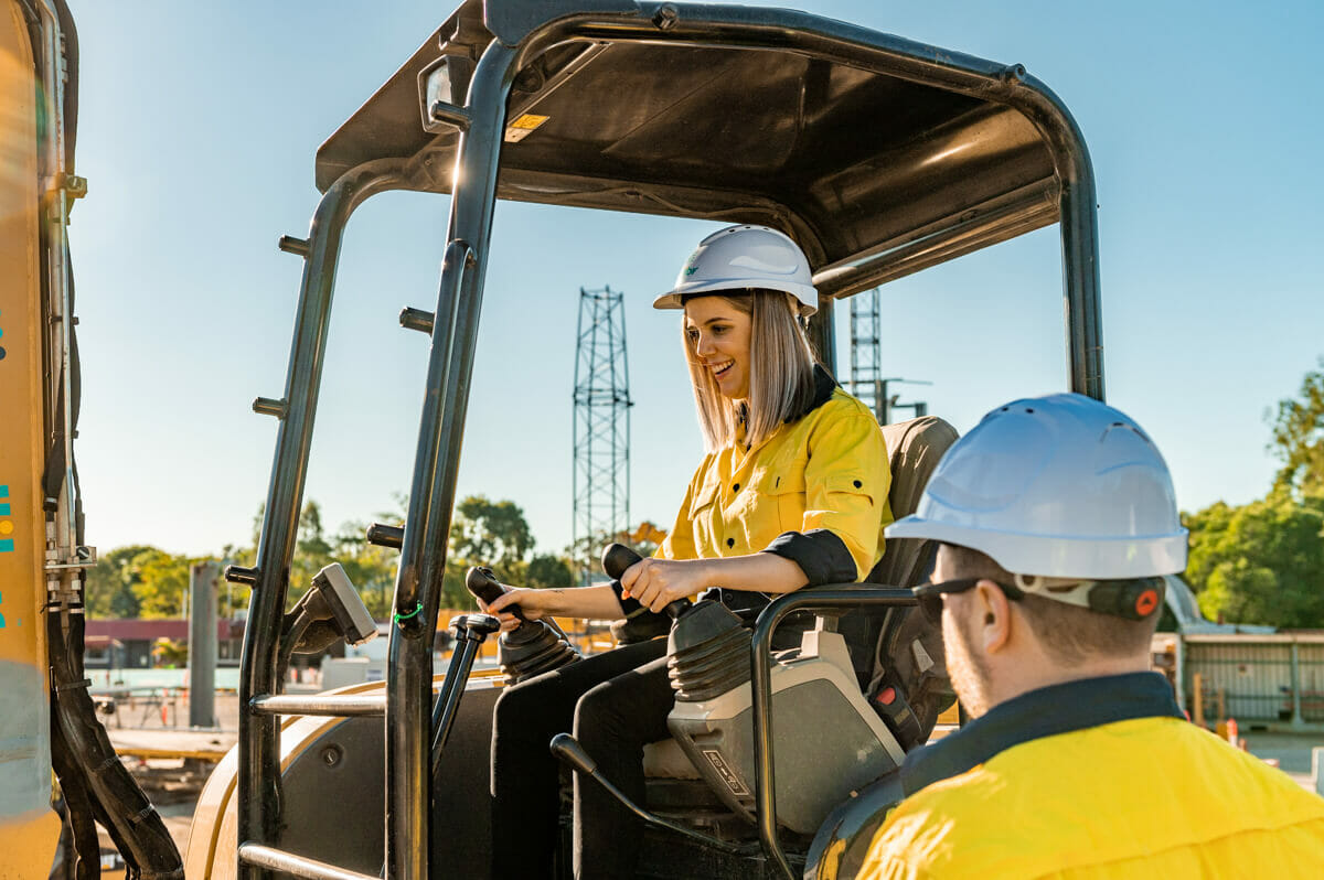 A woman operating a dozer