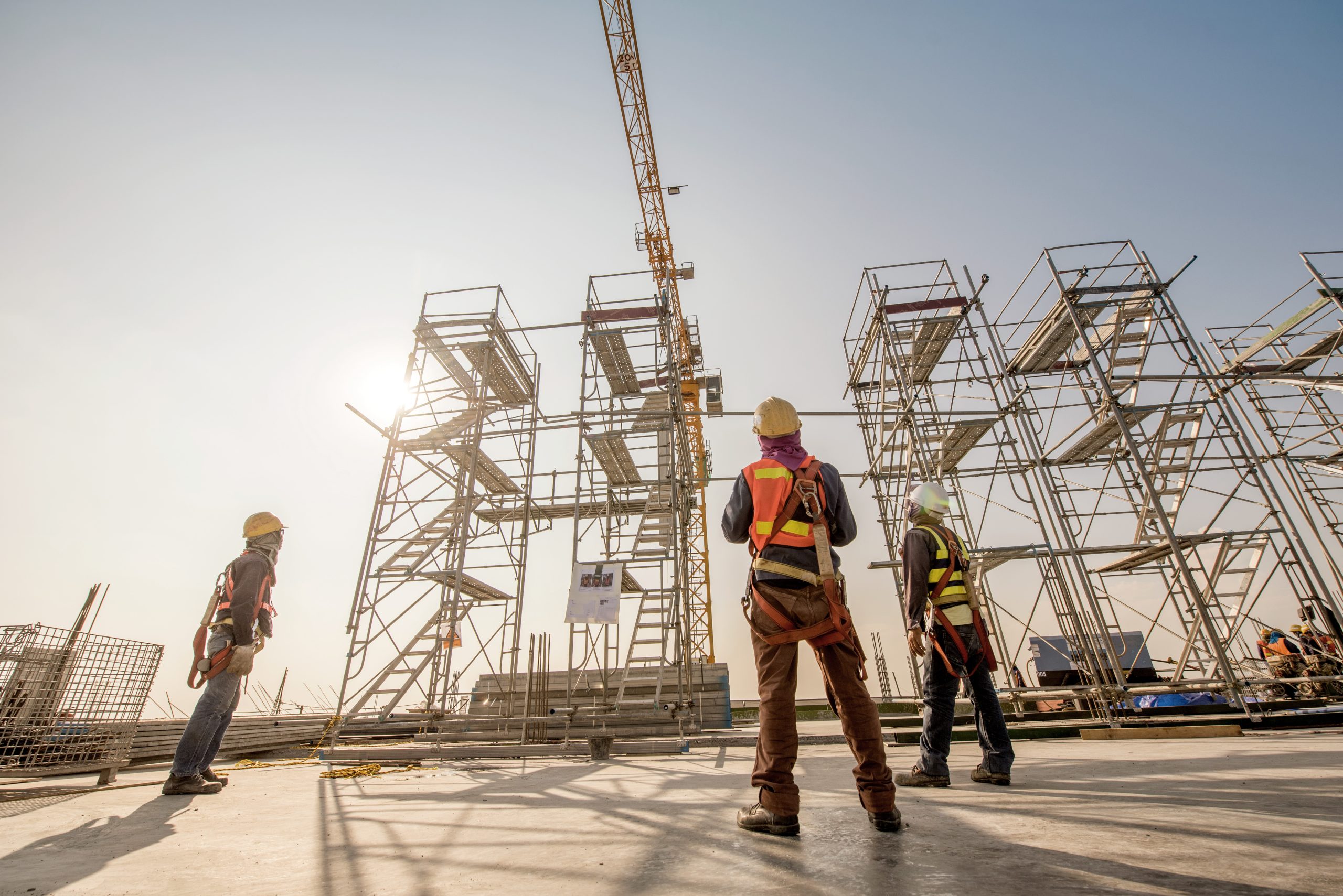 Men looking at Scaffolding on site